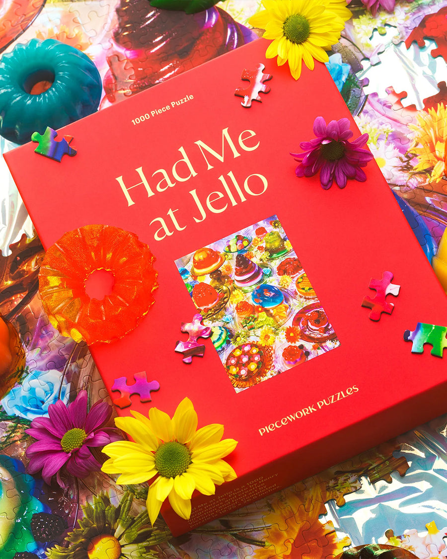 boxed 'had me at jello' 1000 piece puzzle with various colorful jello desserts on a table
