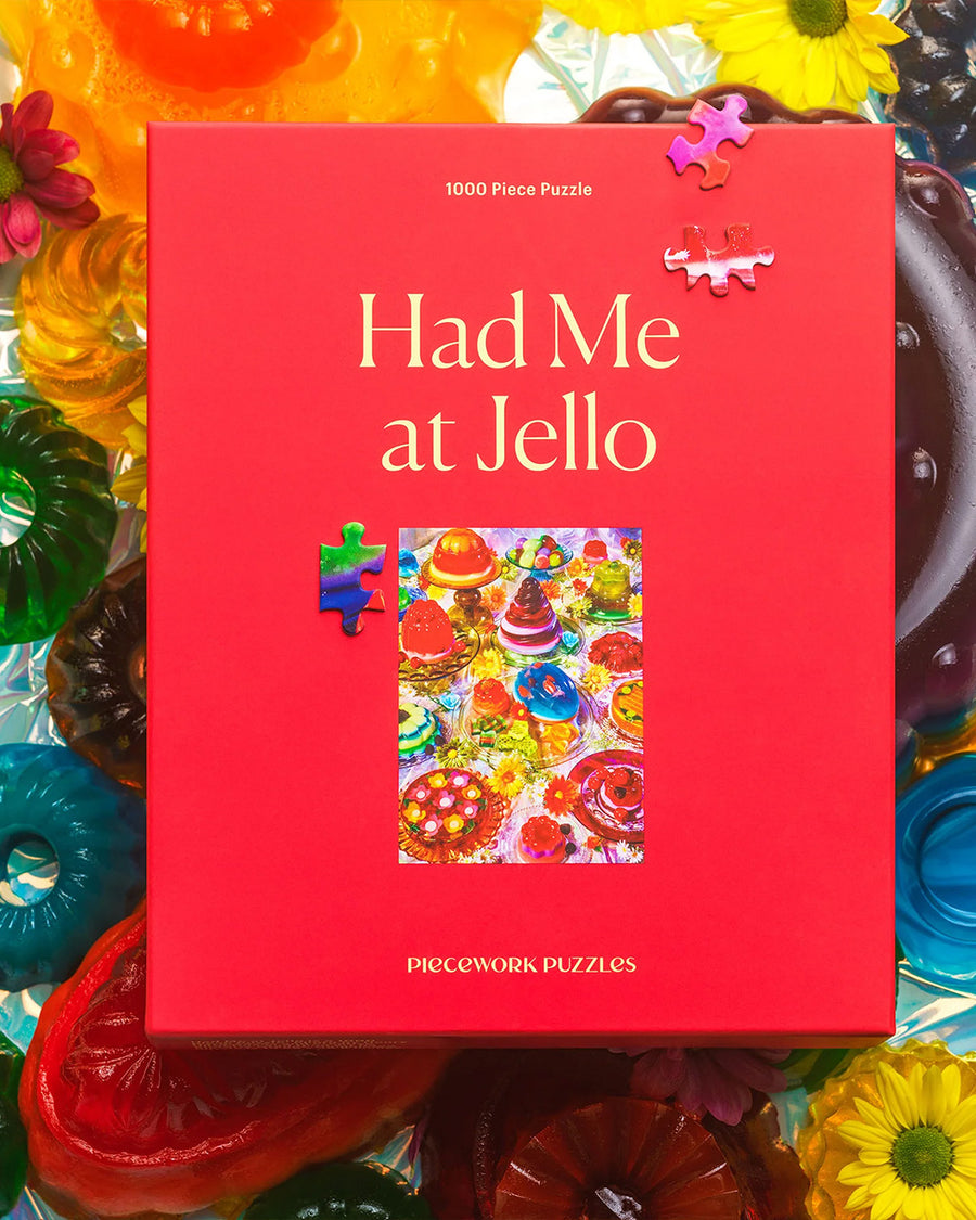 boxed 'had me at jello' 1000 piece puzzle with various colorful jello desserts on a table