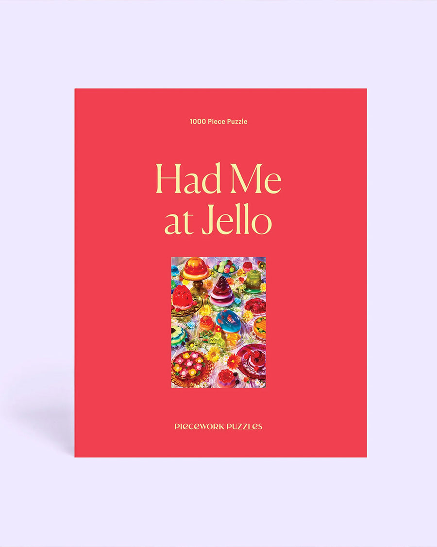 boxed 'had me at jello' 1000 piece puzzle with various colorful jello desserts on a table
