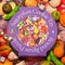 sugar plum cook tin 750 piece puzzle with completed puzzle behind it