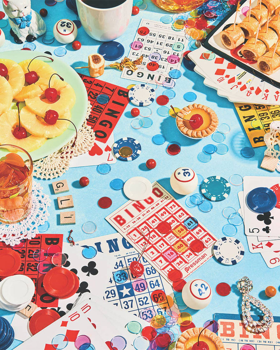 up close of 1000 piece puzzle with various bingo and playing cards