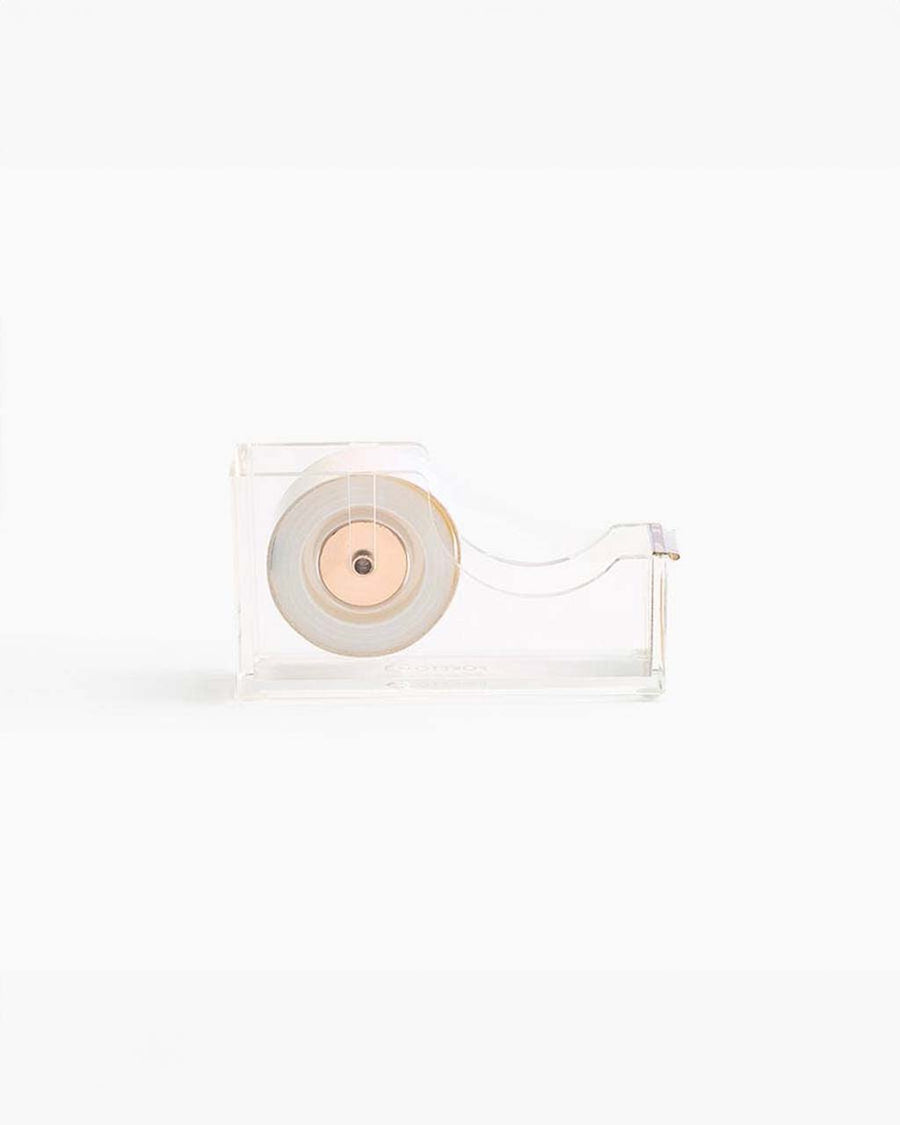 side view of clear lucite tape dispenser with gold accents