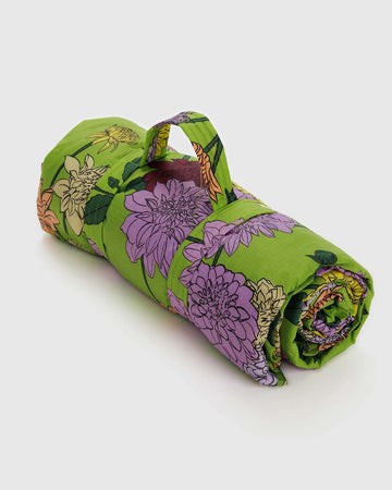 green picnic blanket with colorful dahlia print
