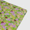 unfolded green picnic blanket with colorful dahlia print