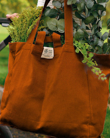 terracotta cotton tote bag with greens inside