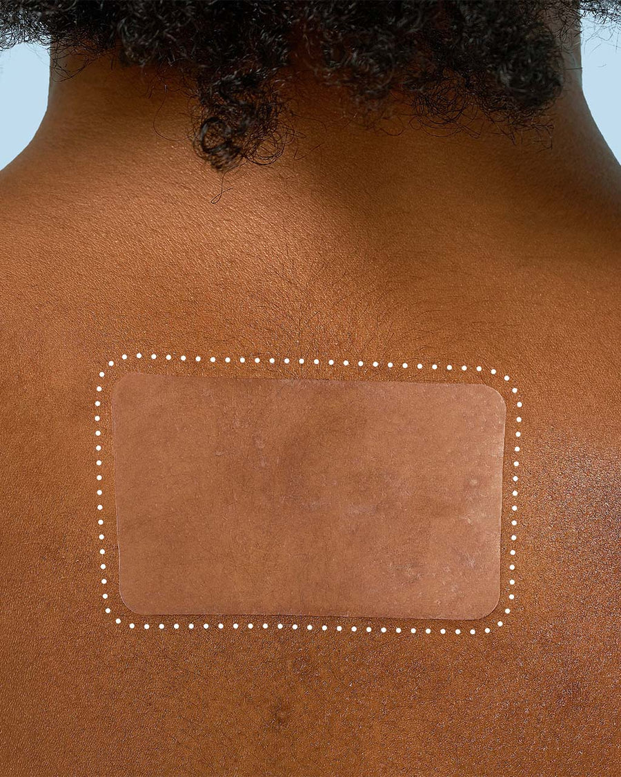 model wearing miracle patch XL spot control cover on their back