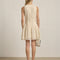 back view of model wearing cream lace mini dress with faux button front detail