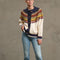 model wearing cream toggle front cardigan with brown, yellow, navy, and raspberry nordic pattern