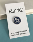 round navy 'night owl book club' with silver trim on cardstock