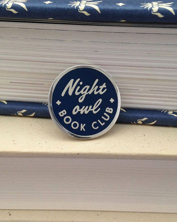 round navy 'night owl book club' with silver trim