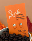 dainty pumpkin spice latte stud earrings on cardstock