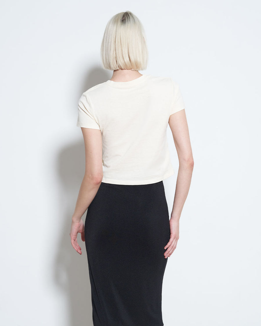 backview of model wearing cream cropped tee with 'the VIP room is closed'