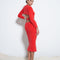 backview of model wearing red fuzzy midi skirt with matching red criss cross top