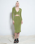 model wearing green slinky midi skirt with matching criss-cross top