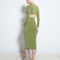 back view of model wearing green slinky midi skirt with matching criss-cross top