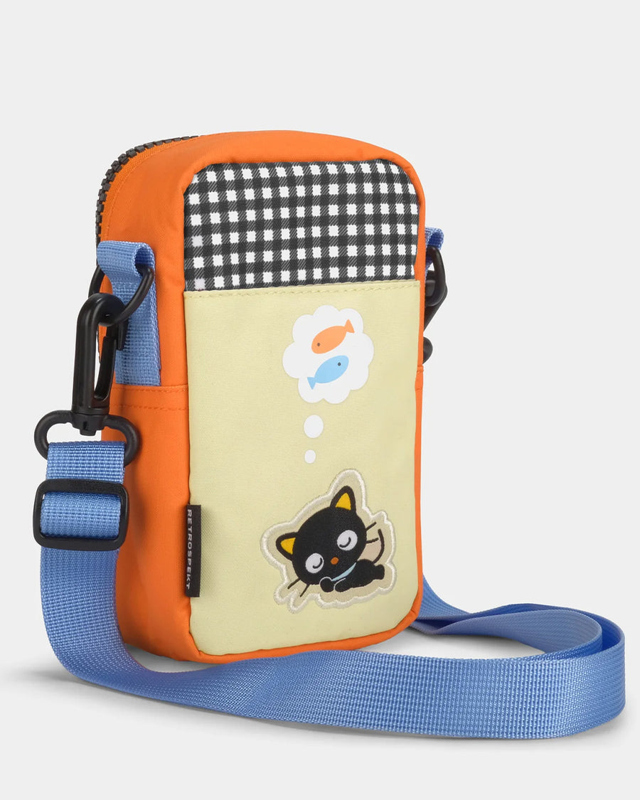 back view of lavender, orange and green color block 35mm camera bag with chococat design