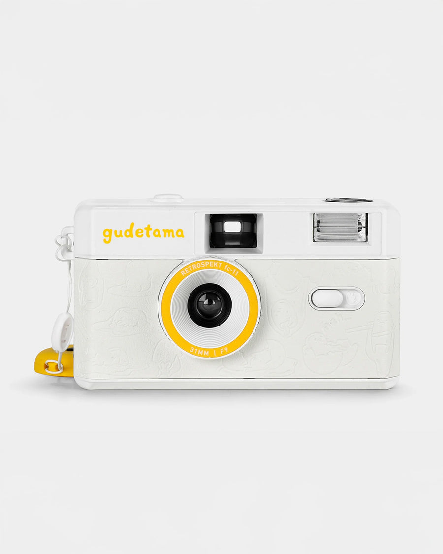front view of white gudetama 35mm camera without lens cover