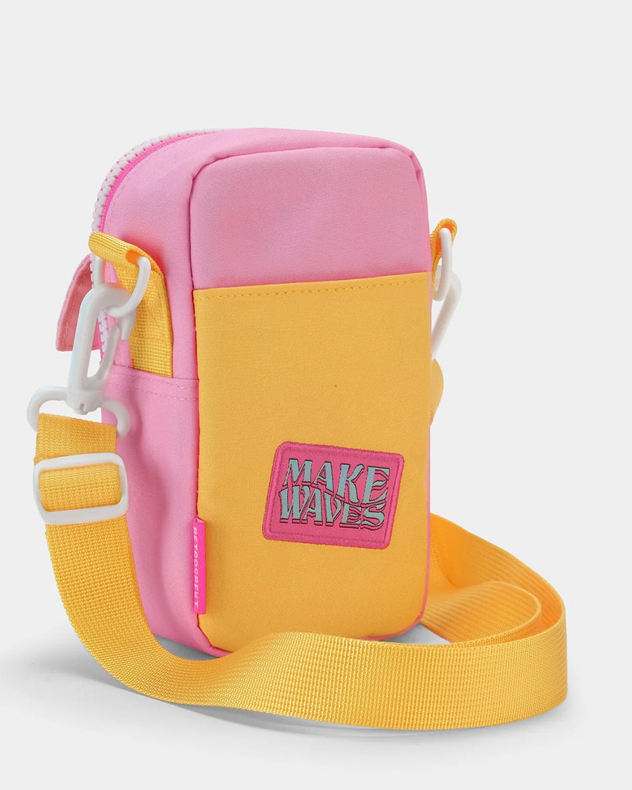 back view of pink, yellow and blue color block 35mm camera bag with malibu barbie design