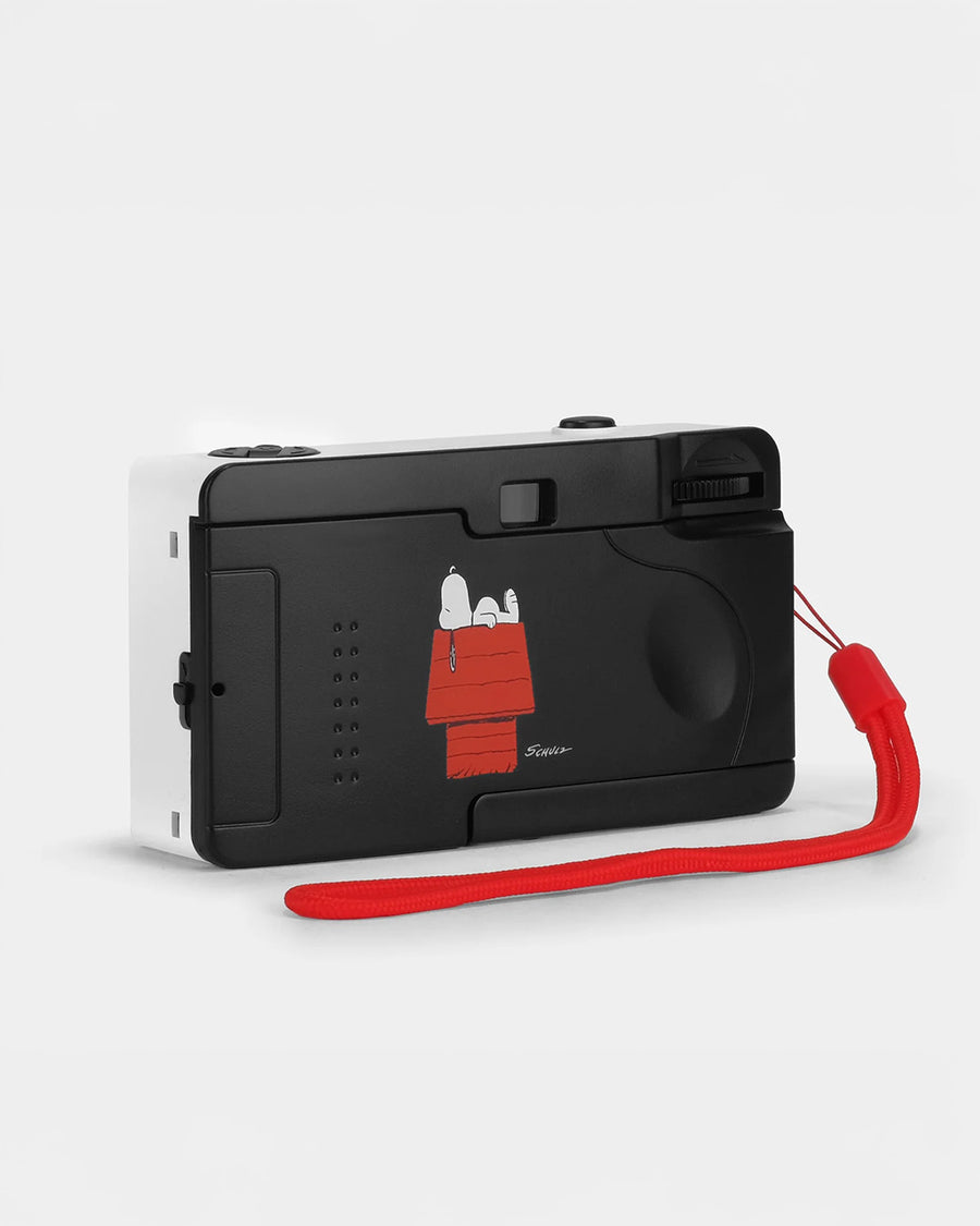 back view of white snoopy and woodstock 35mm camera with red accents