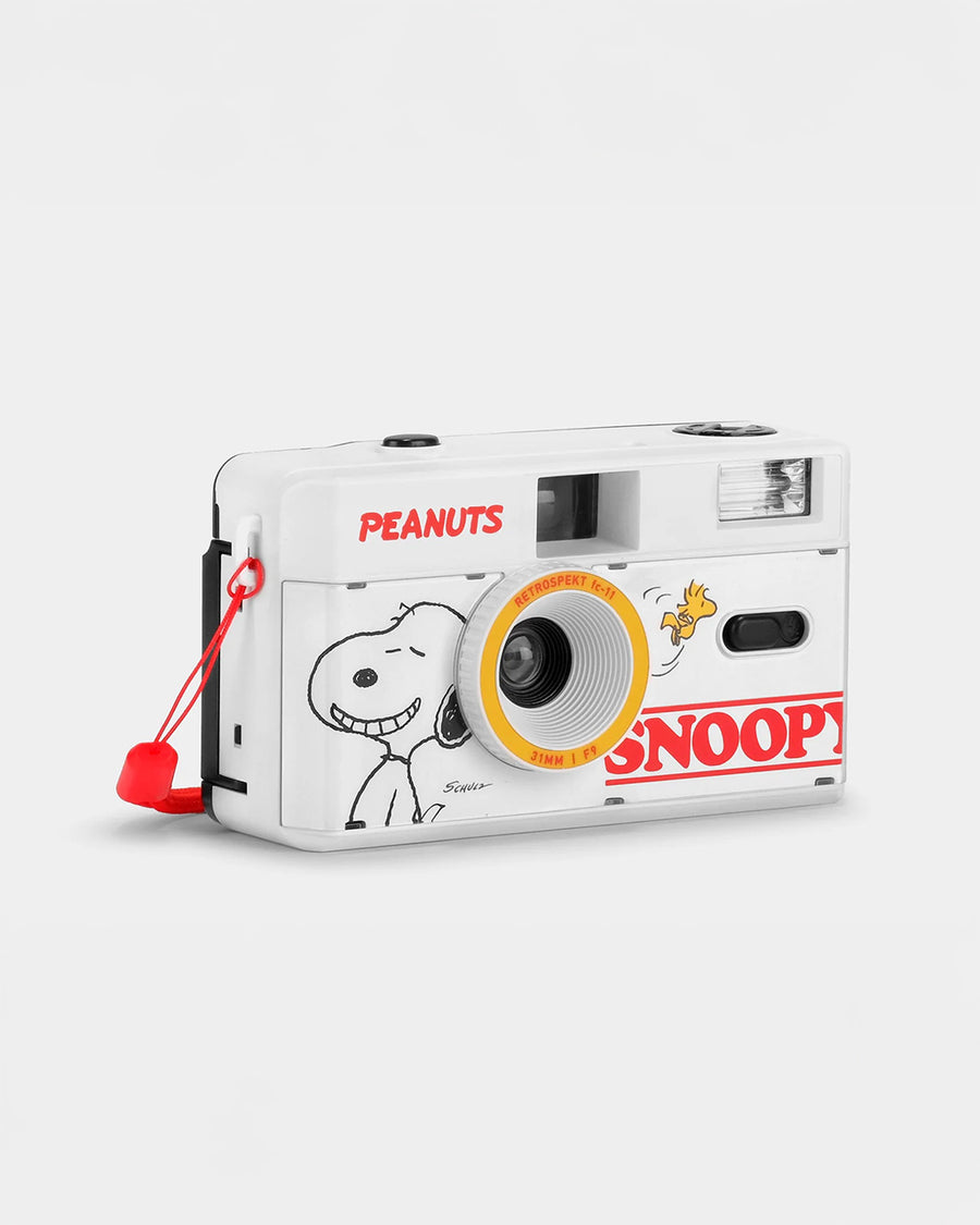 side view of white snoopy and woodstock 35mm camera with red accents