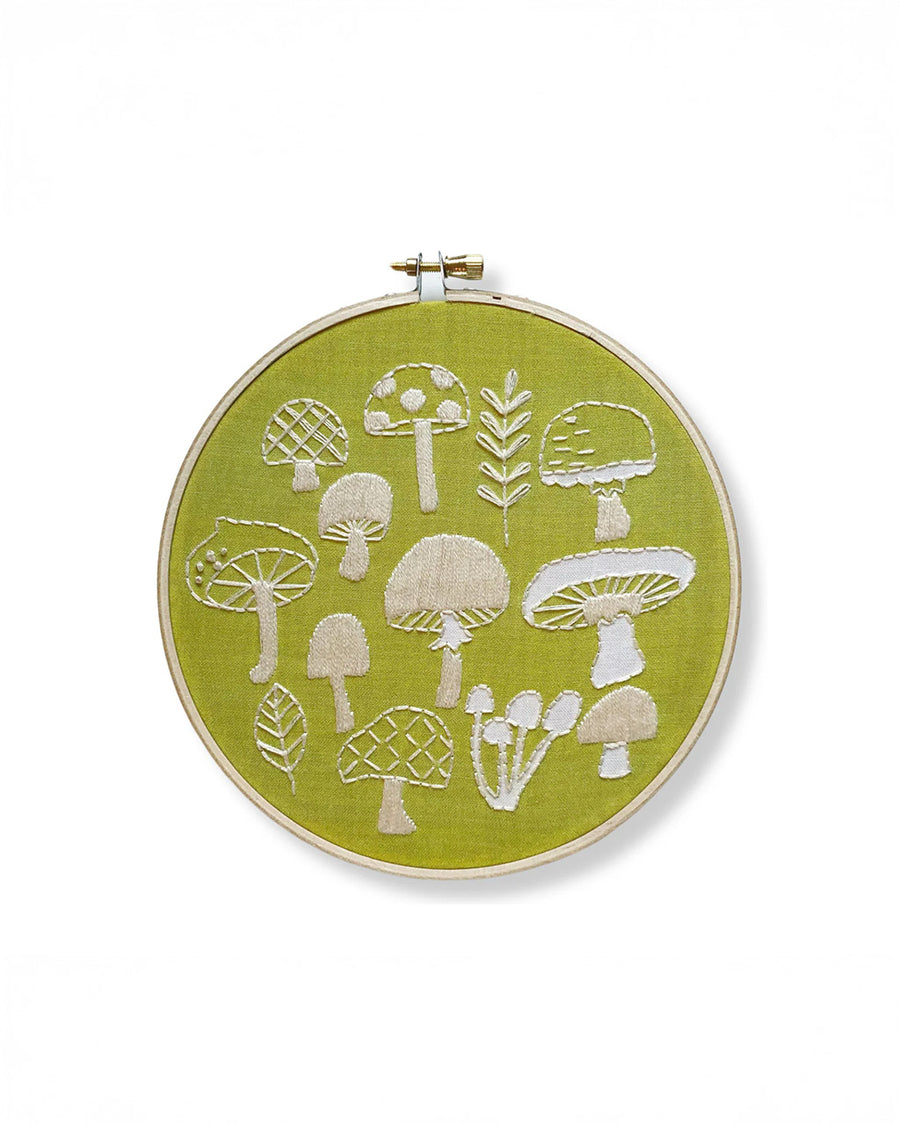 green embroidery kit with cream mushroom design