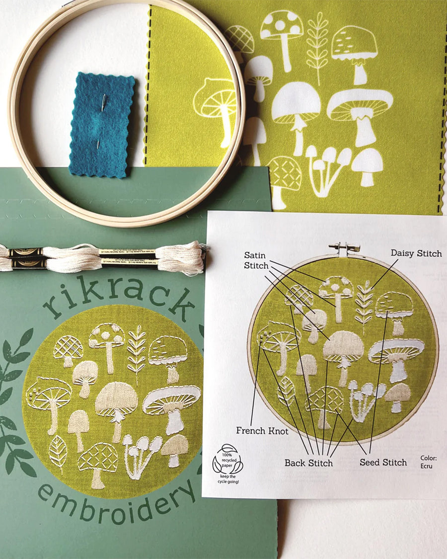 green embroidery kit with cream mushroom design with ring, thread, pre-printed fabric and instructions