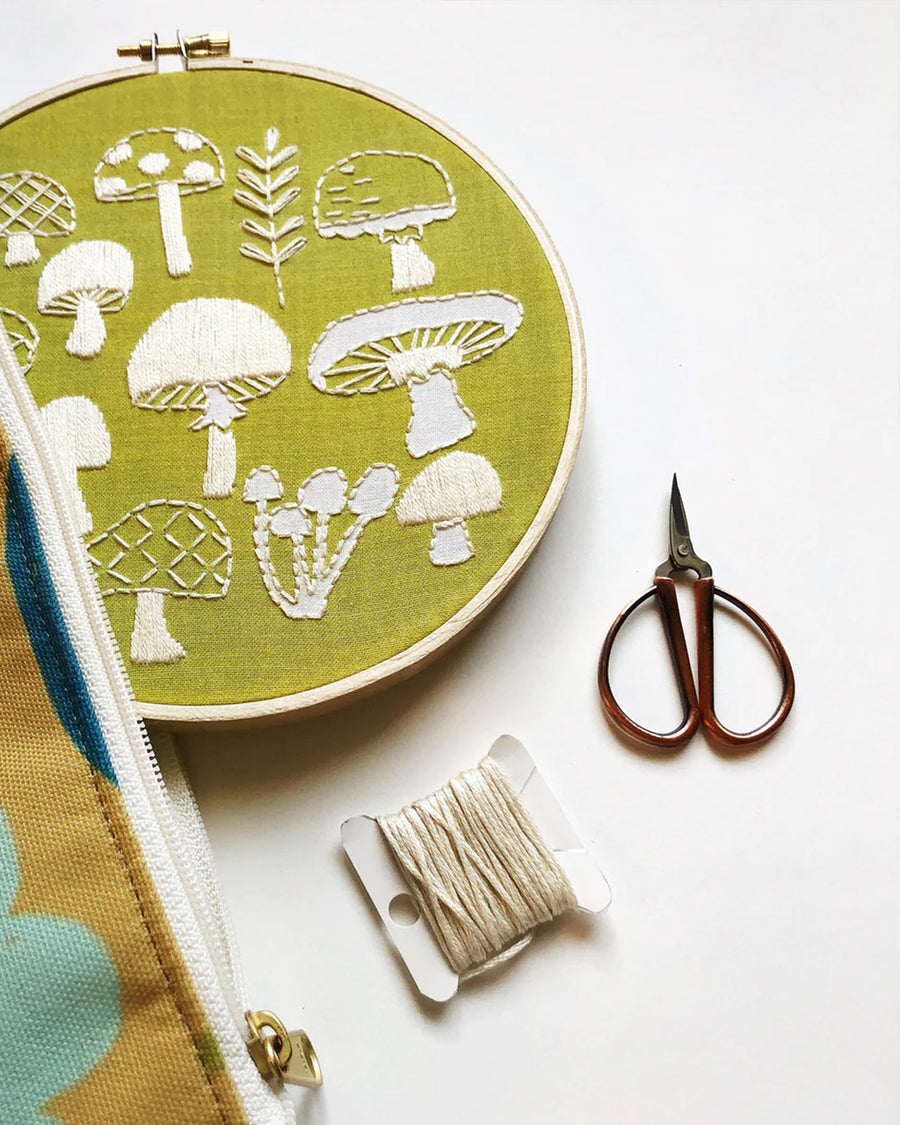 green embroidery kit with cream mushroom design 