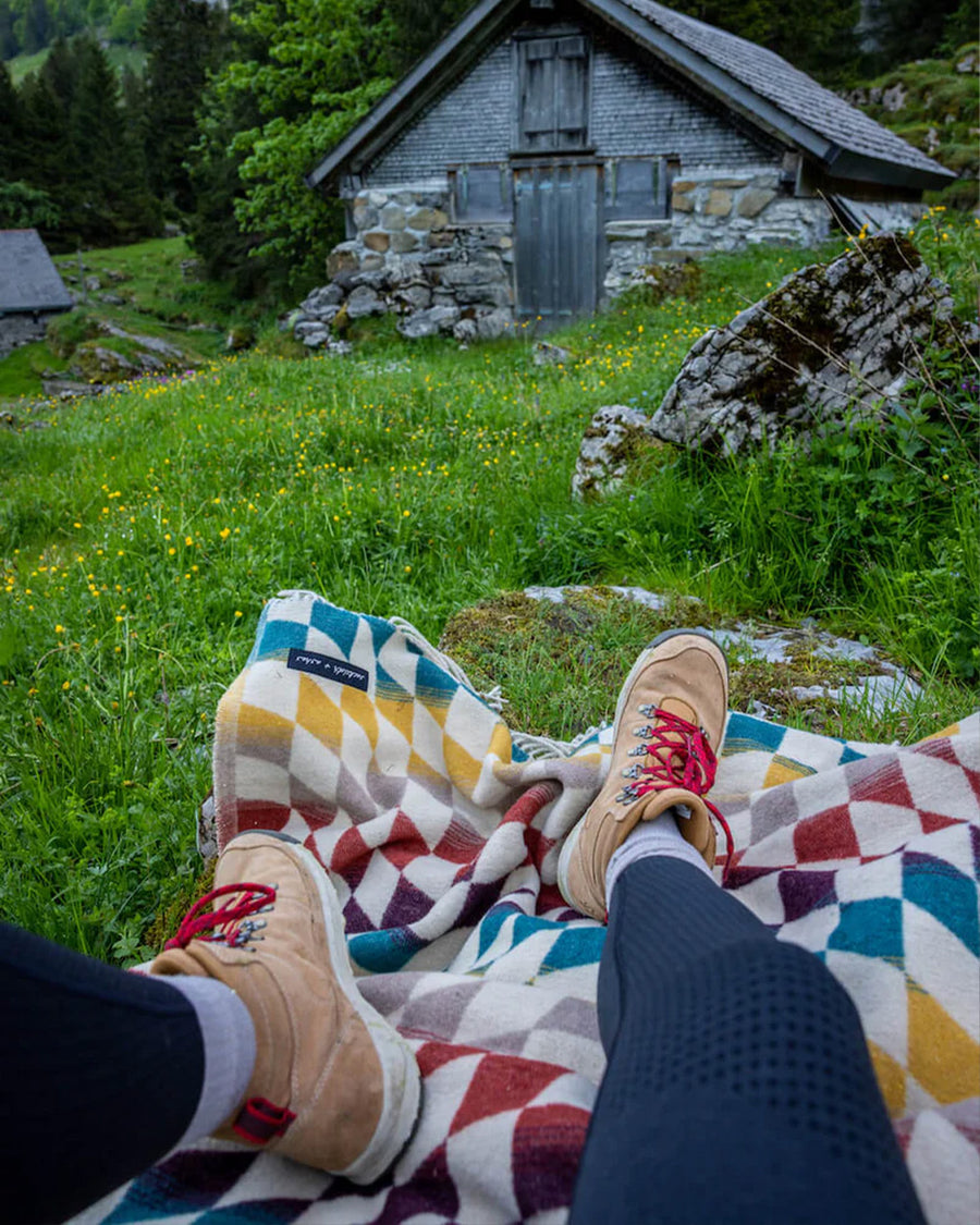 up close of colorful trippy checkered throw blanket