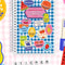 blue and white gingham sticker book with colorful fruit label stickers on the front on a colorful background