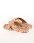 backview of cream, brown and tan woven criss-cross sandals