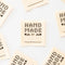 up close of cotton cream 'hand made by' write-in sewing labels
