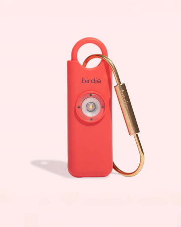coral personal safety device with brass clip for easy accessibility