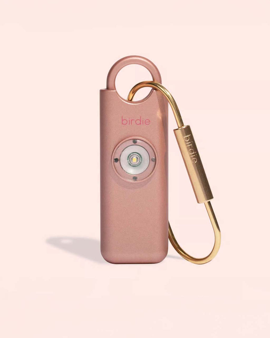 metallic rose gold personal safety device with brass clip for easy accessibility