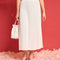 model wearing white pleated midi skirt