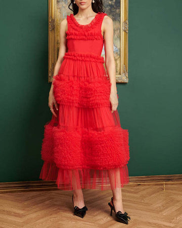 model wearing red sleeveless tulle midi dress with tiered ruffles throughout
