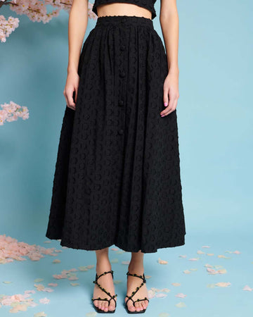model wearing black jacquard button front midi skirt 