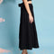 side view of model wearing black jacquard button front midi skirt
