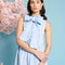 up close of model wearing baby blue tiered midi dress with exaggerated bow neckline