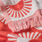 up close of cream and coral red half sun turkish towel with fringe