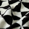 up close of black and white geometric bath towel