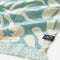cream and sky blue abstract palm tree and sun design turkish towel