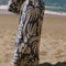 cream and dusty blue abstract palm tree and sun design turkish towel