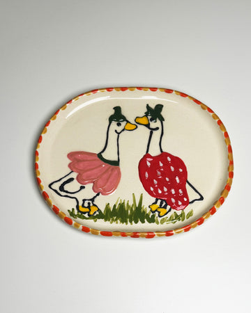 handmade tray with a goose in a pink flower outfit and another in a strawberry outfit