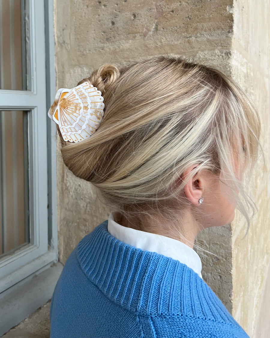 model wearing cream seashell hair claw