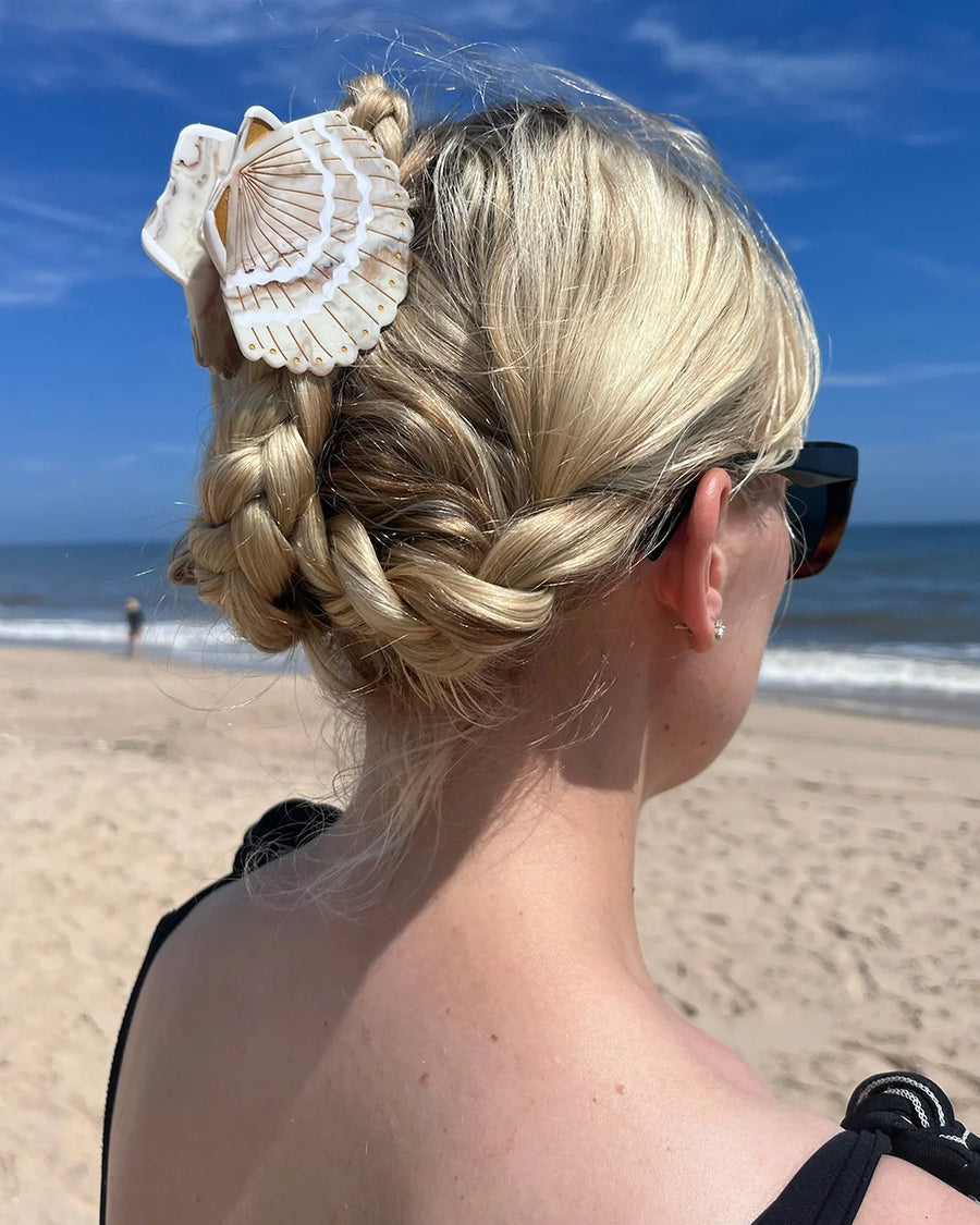 model wearing cream seashell hair claw
