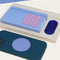 set of three blue tone textured sensory stickers on a phone case, journal and book