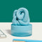 lagoon blue calming putty on a desk