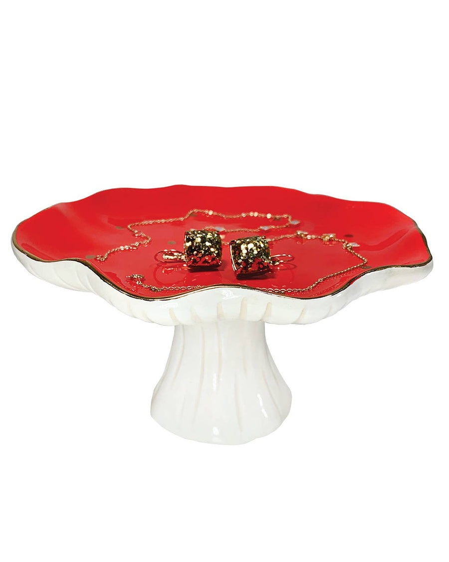 red and white mushroom pedestal trinket dish with gold spots and trim with jewelry on it
