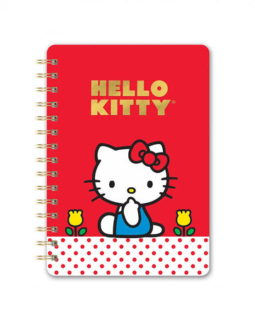 red notebook with gold foil 'hello kitty' and hello kitty character sitting on a white and red polka dot banner