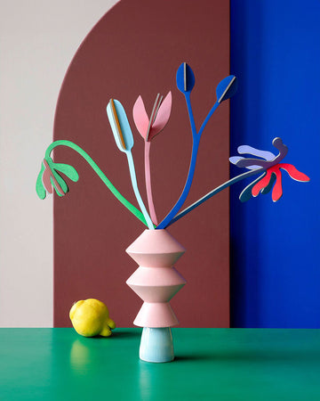 editorial image of five colorful paper flowers